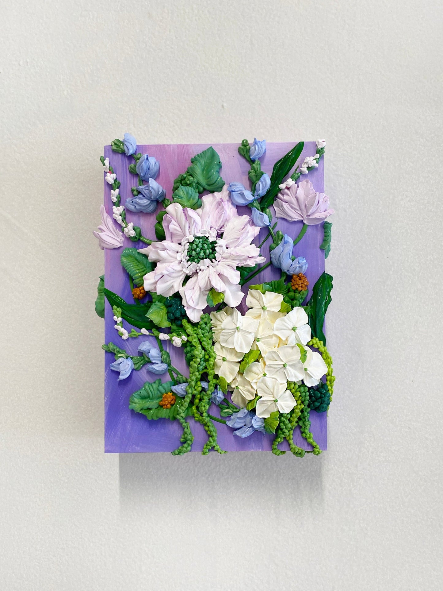Floral arrangement on a purple background