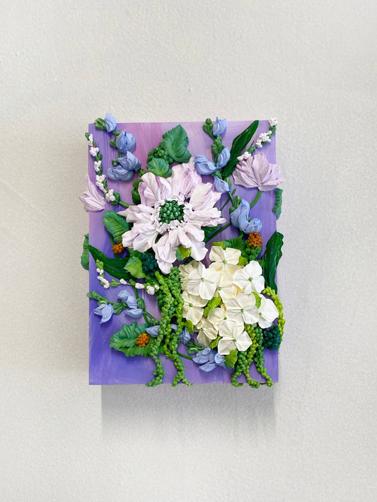 Floral arrangement on a purple background